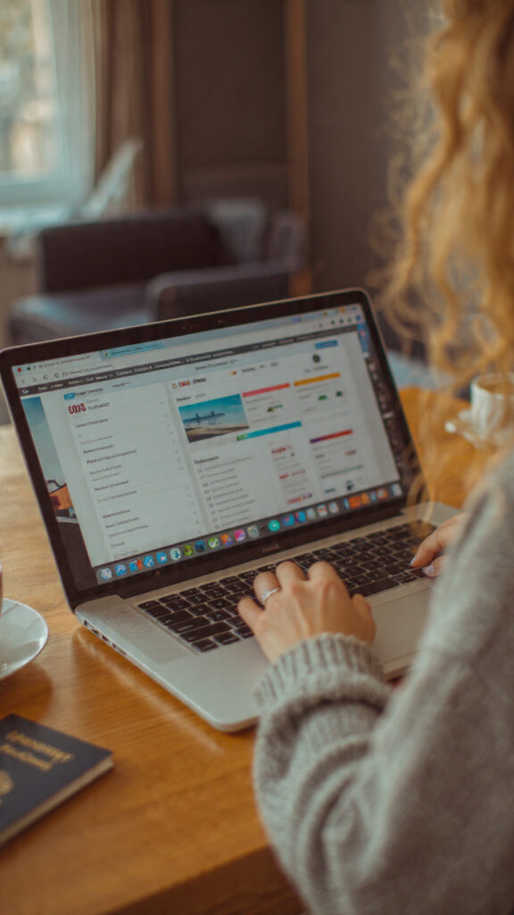  “Laptop screen showing several flight comparison websites and price calendars side by side”
