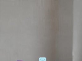 Laptop screen showing digital marketing analytics with social media, email, and search icons around it
