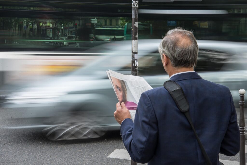 Person reading political news on tablet staying informed about current events